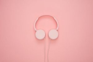 Aesthetic pink headphones on a pastel background, perfect for a modern and stylish look.